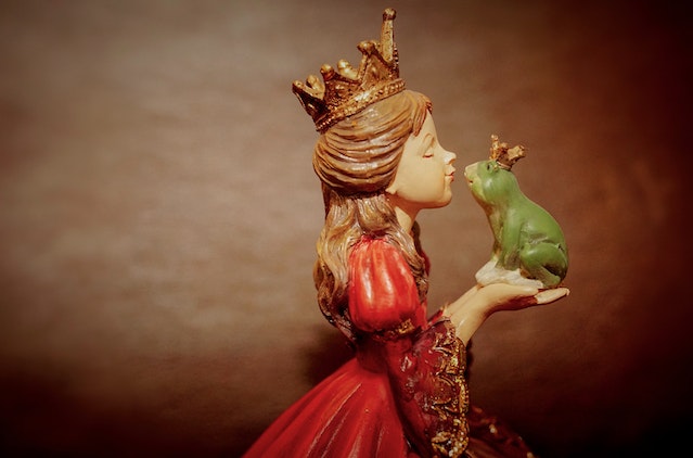 A princess in a red dress kissing a frog.
(Learning Serbian language idioms Unless your grandma was a princess who kissed a frog, don't mix them!)
