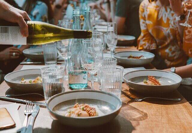 DOs and DON’Ts in Serbia: 10 Most Important Things to Know 4 dos and don'ts in serbia serbian food dinner table with plates and food
