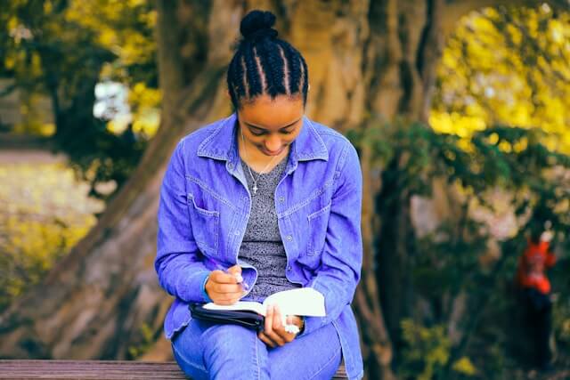 Serbian Modern Writers: 8 Authors You Must Know About 3 serbian modern writers girl holds book and a pencil