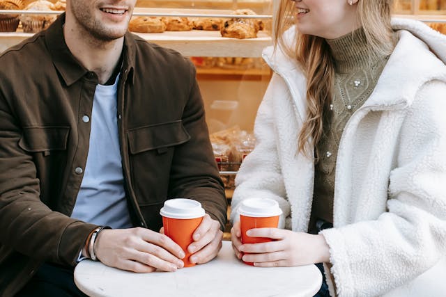 Dating in Serbia: Your Detailed Guide 2 dating in serbia two people hoding coffee cups sitting close to each other